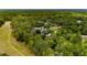 Areal view of property showcasing a home nestled within a dense, mature forest at 9213 Sw 197Th Cir, Dunnellon, FL 34432