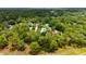 Areal view of property showcasing a home nestled within a dense, mature forest at 9213 Sw 197Th Cir, Dunnellon, FL 34432