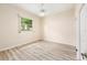Bedroom features vinyl plank flooring, natural light, and closet at 9213 Sw 197Th Cir, Dunnellon, FL 34432