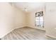 Bright bedroom with high ceilings, fan, and stylish wood-look flooring at 9213 Sw 197Th Cir, Dunnellon, FL 34432