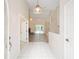 Inviting foyer boasts tile flooring, high ceilings and flows into living area with wood floors at 9213 Sw 197Th Cir, Dunnellon, FL 34432
