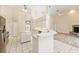 Open kitchen view with island, stainless appliances, and access to living areas at 9213 Sw 197Th Cir, Dunnellon, FL 34432