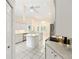 Well-lit kitchen featuring an island, white cabinets and stainless steel appliances at 9213 Sw 197Th Cir, Dunnellon, FL 34432