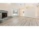 Open living area features a fireplace, sliding glass doors, and neutral tones at 9213 Sw 197Th Cir, Dunnellon, FL 34432