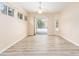 Bright Living Room features vinyl plank flooring and access to backyard area with a pool at 9213 Sw 197Th Cir, Dunnellon, FL 34432