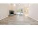Bright living room with brick fireplace and sliding glass doors to the pool at 9213 Sw 197Th Cir, Dunnellon, FL 34432
