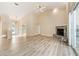 Spacious living room with vaulted ceilings and a brick fireplace at 9213 Sw 197Th Cir, Dunnellon, FL 34432