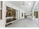 Expansive screened patio featuring a summer kitchen, ceiling fans, and sliding glass doors to the pool at 9213 Sw 197Th Cir, Dunnellon, FL 34432