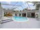 Beautiful pool area with a screened-in enclosure, gazebo, and a well-maintained pool and spa at 9213 Sw 197Th Cir, Dunnellon, FL 34432