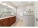 Bathroom featuring double vanity, tiled floors, and a glass-enclosed shower at 9236 Sw 91St Court Rd, Ocala, FL 34481
