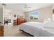 Cozy bedroom with wood floors, neutral walls, and plenty of natural light at 9236 Sw 91St Court Rd, Ocala, FL 34481