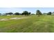 Beautiful golf course with lush green grass and mature trees in the distance at 9236 Sw 91St Court Rd, Ocala, FL 34481