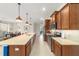 Large kitchen features an oversized island, stainless steel appliances, and ample cabinet space at 9236 Sw 91St Court Rd, Ocala, FL 34481