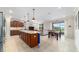 Open-concept kitchen with a large island and view of the dining and living area at 9236 Sw 91St Court Rd, Ocala, FL 34481