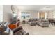Cozy living room showcasing a comfortable sectional sofa and natural light, seamlessly blending relaxation and functional design elements at 9236 Sw 91St Court Rd, Ocala, FL 34481