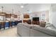 Inviting living area featuring an open-concept design, seamlessly integrating with a modern kitchen and a comfortable seating arrangement at 9236 Sw 91St Court Rd, Ocala, FL 34481
