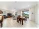 Inviting open concept living area with dining space, and access to outdoor views at 9236 Sw 91St Court Rd, Ocala, FL 34481