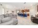 Open concept living area featuring a modern kitchen with a blue island, seamlessly connecting the living space for easy gatherings at 9236 Sw 91St Court Rd, Ocala, FL 34481