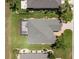 Aerial view of home showing the screen enclosed patio, landscaping, and roof at 9315 Sw 66Th Loop, Ocala, FL 34481
