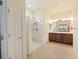 Bathroom featuring a shower, double sinks, and a large mirror at 9315 Sw 66Th Loop, Ocala, FL 34481