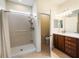 Clean bathroom featuring a walk-in shower, a sink with a vanity, and a toilet room at 9315 Sw 66Th Loop, Ocala, FL 34481