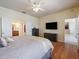 Spacious bedroom features hardwood floors, ceiling fan and access to an ensuite bathroom at 9315 Sw 66Th Loop, Ocala, FL 34481