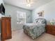 Relaxing bedroom with carpeted floors and light blue walls, offering a peaceful retreat at 9315 Sw 66Th Loop, Ocala, FL 34481