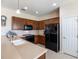 Well-equipped kitchen features stainless steel appliances, wood cabinets, and ample counter space at 9315 Sw 66Th Loop, Ocala, FL 34481