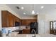 Spacious kitchen boasts wood cabinetry, stainless steel appliances, and plenty of counter space at 9315 Sw 66Th Loop, Ocala, FL 34481