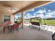 Relax on the screened patio with outdoor seating, ceiling fan, and views of the lush greenery at 9315 Sw 66Th Loop, Ocala, FL 34481