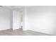 A brightly lit empty bedroom with light wood floors at 10032 Sw 85Th Place Rd, Ocala, FL 34481