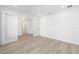 Bright room featuring light wood floors, white trim, recessed lighting, and a wide doorway at 10032 Sw 85Th Place Rd, Ocala, FL 34481