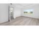 Bright bedroom with a view through the window and light wood floors at 10032 Sw 85Th Place Rd, Ocala, FL 34481