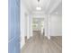 Bright foyer featuring wood-look flooring and an open floor plan into the main living areas at 10032 Sw 85Th Place Rd, Ocala, FL 34481