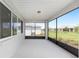 Screened lanai features a ceiling fan and views of the backyard at 10032 Sw 85Th Place Rd, Ocala, FL 34481