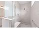 Modern walk-in shower features sleek tile, a built-in bench, and a glass enclosure at 10032 Sw 85Th Place Rd, Ocala, FL 34481