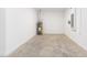 Unfinished utility room with water heater and concrete floors at 10032 Sw 85Th Place Rd, Ocala, FL 34481