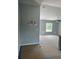 Living room area features modern lighting, neutral paint, and an open window at 10385 Se 125Th Ln, Belleview, FL 34420