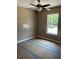 Neutral bedroom featuring ceiling fan and ample natural light at 10401 Se 125Th Ln, Belleview, FL 34420