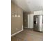 New kitchen featuring stainless steel refrigerator, white cabinets, and chandelier at 10401 Se 125Th Ln, Belleview, FL 34420