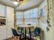 Breakfast nook featuring decorative window treatments and seating for three at 10459 Sw 62Nd Ct, Ocala, FL 34476