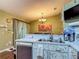 Bright kitchen featuring a stainless steel dishwasher and sink with decorative cabinet doors at 10459 Sw 62Nd Ct, Ocala, FL 34476