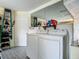 Laundry room featuring a washer and dryer and storage solutions at 10459 Sw 62Nd Ct, Ocala, FL 34476