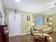 This living room features hardwood floors, bright natural light, and comfortable seating at 10459 Sw 62Nd Ct, Ocala, FL 34476