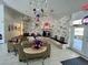 Inviting lobby with comfortable seating, stone accent wall, and patriotic decorations enhancing the welcoming atmosphere at 10459 Sw 62Nd Ct, Ocala, FL 34476