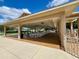 Community pavilion featuring ceiling fans, ample seating and tables, ideal for outdoor gatherings and relaxation at 10459 Sw 62Nd Ct, Ocala, FL 34476