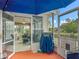 Enclosed patio with an outdoor grill under an umbrella, with seating at 10459 Sw 62Nd Ct, Ocala, FL 34476