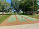 Enjoy a game of shuffleboard on these well-maintained outdoor courts, perfect for community recreation at 10459 Sw 62Nd Ct, Ocala, FL 34476