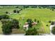 Aerial view of the home and property boundary, highlighting the estate's layout amidst a verdant landscape at 12131 Ne 10Th Ter, Ocala, FL 34479