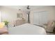 Bedroom with a ceiling fan, large closet, and comfortable sitting area at 12131 Ne 10Th Ter, Ocala, FL 34479